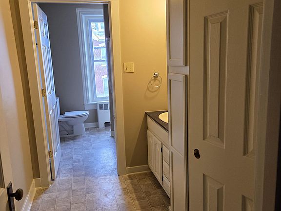 Hollywood bathroom, freshly painted with double the usual storage space.