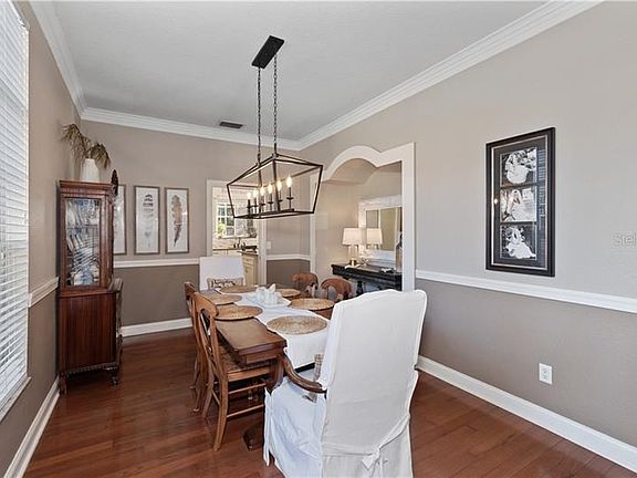 Elegant dining room also has a hidden storage closet by the alcove.