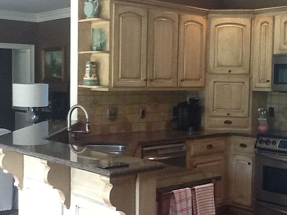 Antiqued cabinets & granite