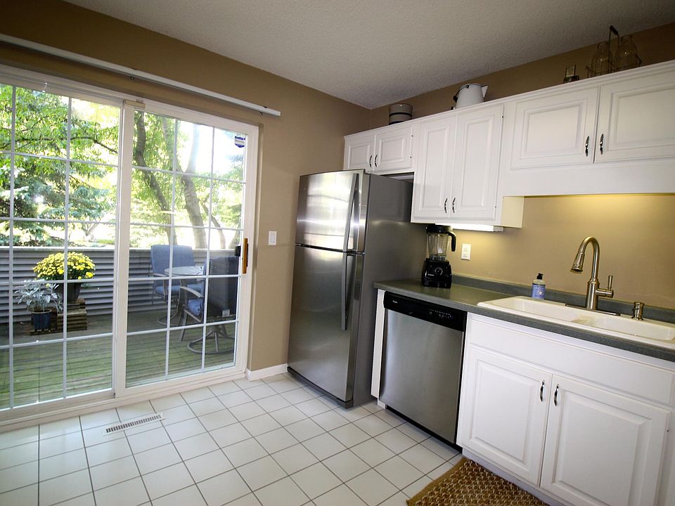 Bright kitchen that walks out to the side patio.