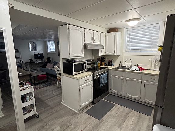 Kitchen with livingroom seen to left.