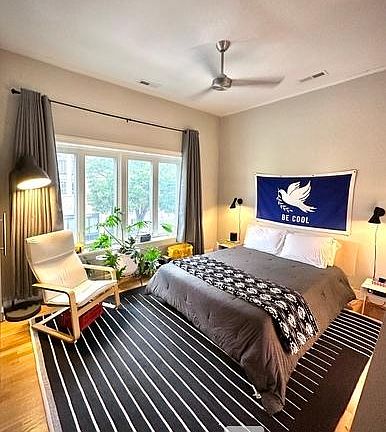 Primary bedroom with operable windows with screens