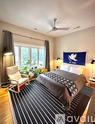 Primary bedroom with operable windows with screens