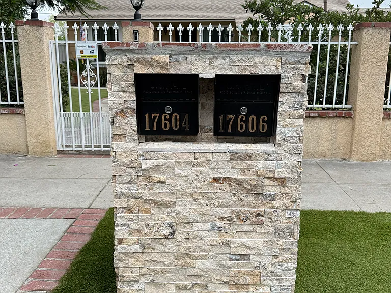 Front gated entry with locked mailboxes