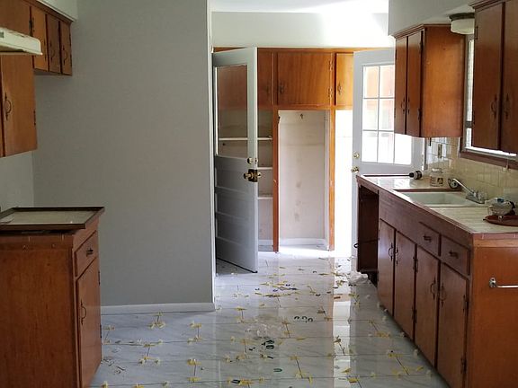 Tiles being laid in kitchen