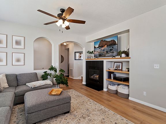 Living room with gas fireplace and oak shelving