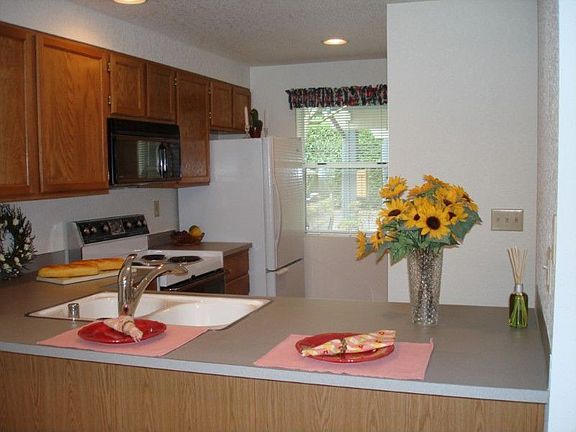 Convenient kitchen w/eating space; refrigerator included