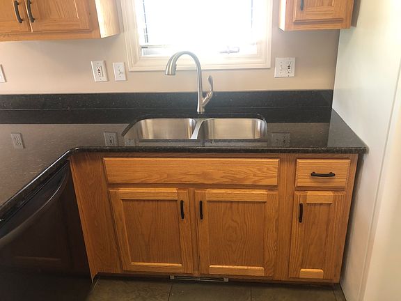 Newer stainless-steel sink and faucet.