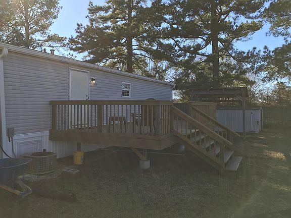 12' x 24' Raised Deck in Backyard with Stairs leading to well maintained grass fenced backyard