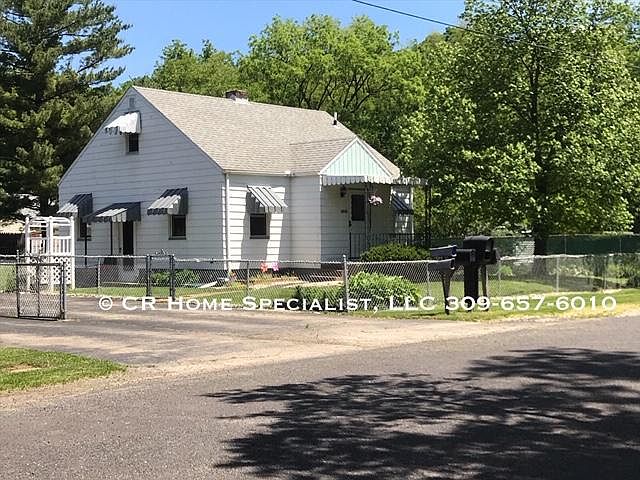 Cute 1 1/2 story home with awnings to shelter you from sun and rain