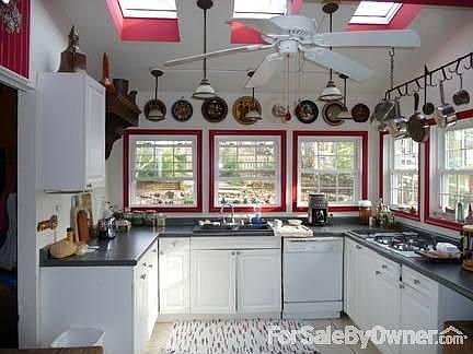 Bright Kitchen : 6 windows and 3 skylights give the kitchen an outdoor feel, has ceramic tile