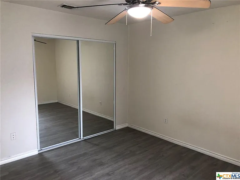 Secondary bedroom 12' x 13' with mirrored closet, LED light/ceiling fan