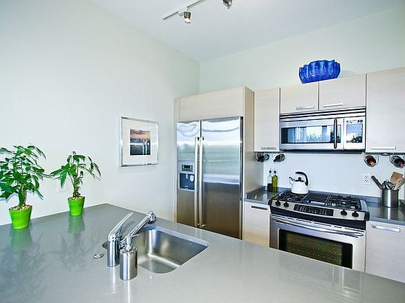 Lots of quartz stone counter space and a bar. 