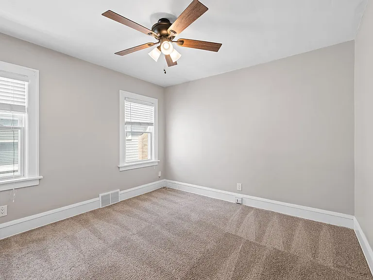 This photo shows the second bedroom on the second/main floor of the unit.