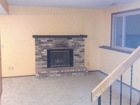 Downstairs fireplace and living room.