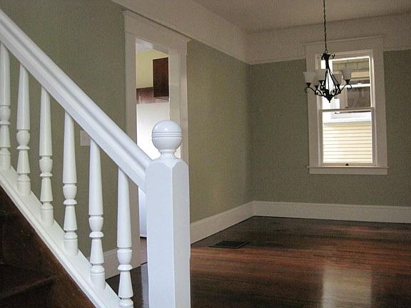 Part of dining room and stairs to 2d floor