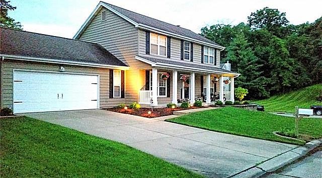 This lovely 2 story home is surrounded by beautiful treed views.