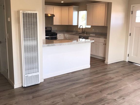 Living room looking into kitchen