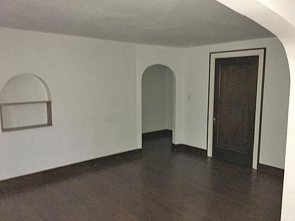 Arch doorway from entrance hallway to living room