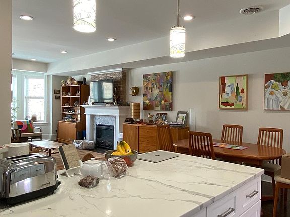 View from kitchen island to the dining area the rest of the living room