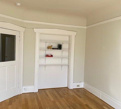 Front room shelving area behind door . Front room 3rd floor Gough and Filbert.