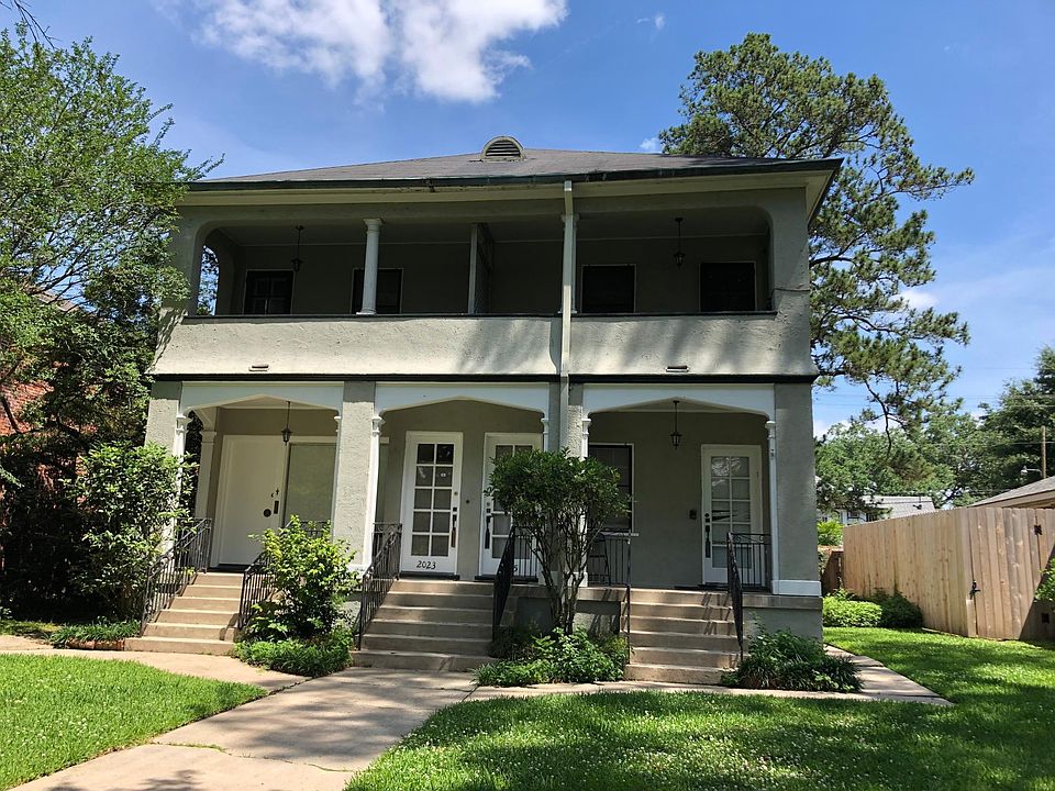 Historic building on tree-lined avenue