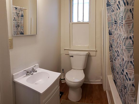 bathroom with new toilet, new floor, new vanity and medicine