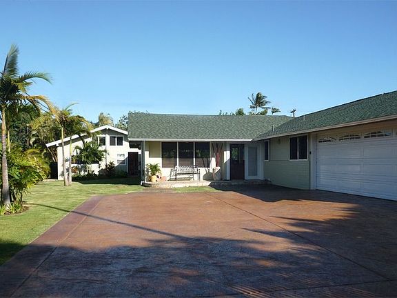 Large side-yard leading to studio cottage w/loft
