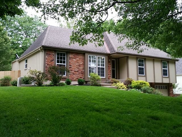 Beautifully updated and landscaped home with mature oak and mapl