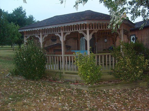 gazebo attached to back deck of house