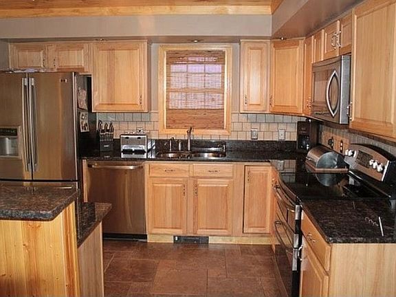 kitchen looking in to backyard pool and deck