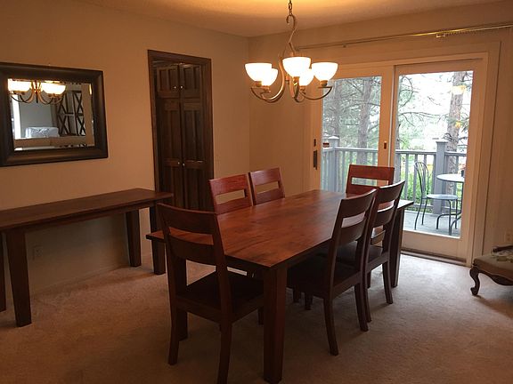 Formal dining room looking out onto the north sitting deck. Great for morning coffee or enjoying evenings before sundown.