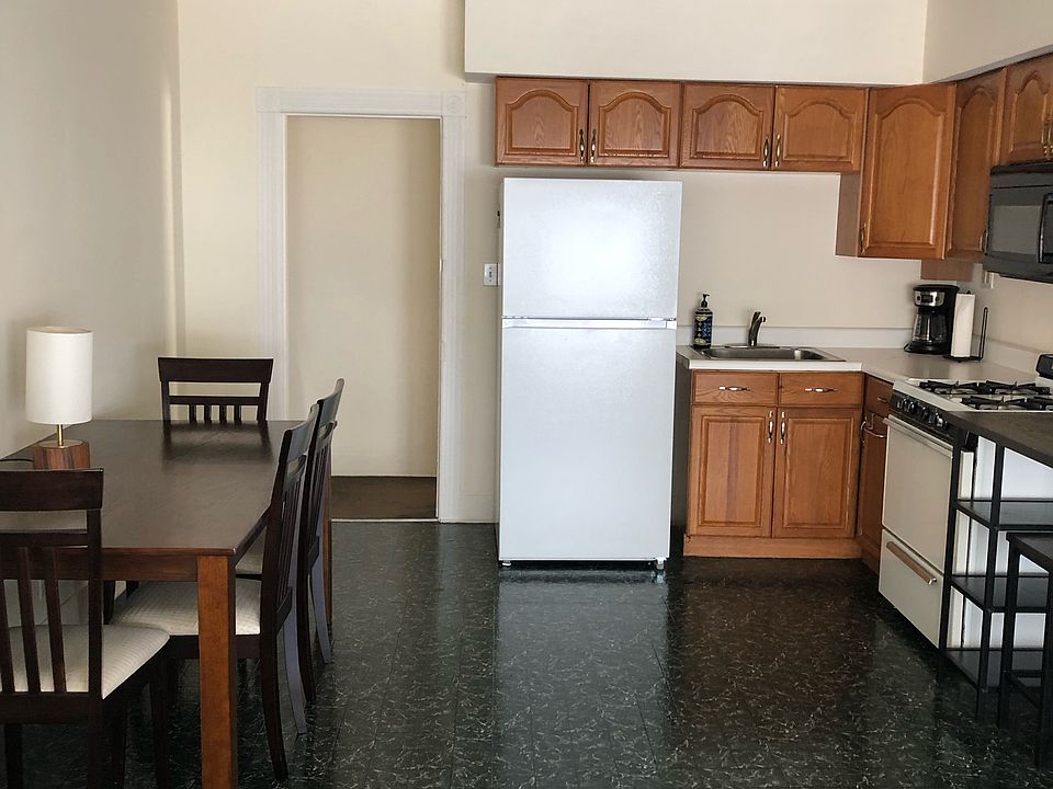 Kitchen with Brand NEW refrigerator. 
Also, microwave, stove and countless utensils to make your stay feel at home.