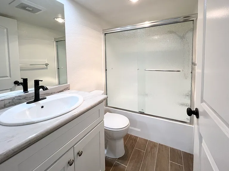 Guest Bathroom w/tile flooring & granite countertops