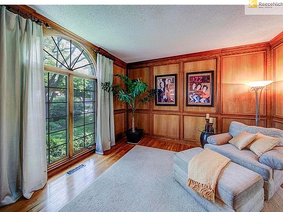 HANDSOME LIBRARY, OFFICE, DEN OFF OF THE TWO STORY TILED ENTRY WAY