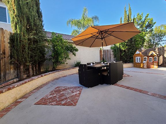 Imagine yourself with a glass in your hand, laughter and great conversation around this very large table in a very large private back patio.