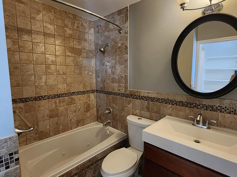 Second Floor: Master Bath with beautiful tiles and Jacuzzi Tub.