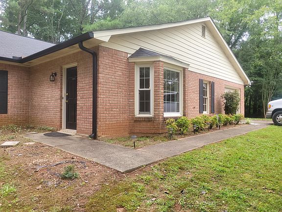Sidewalk from parking drive to front door.