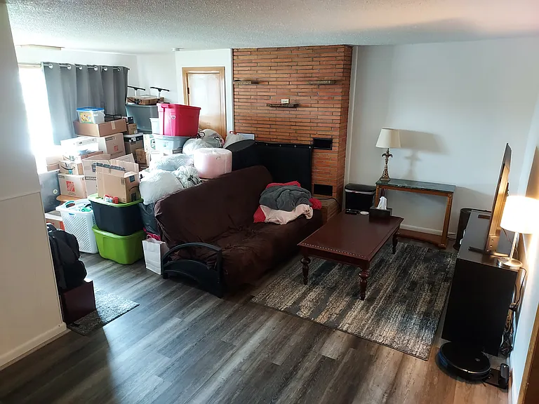 Living/Dining room w/ new flooring throughout.