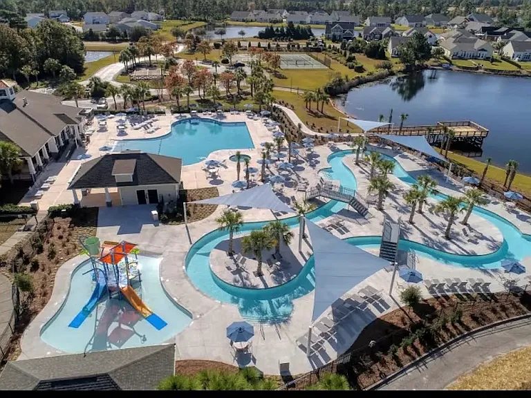 Aerial view of Clubhouse area with additional pool, lazy river and numerous other activities
