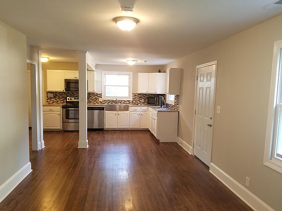 Same view of the den looking into the kitchen (just not furnished)