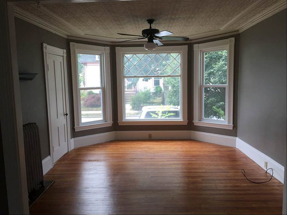 Living room is sun-drenched in the afternoon - a must-see! Room also has a large under stairway closet for storage (seen on left).