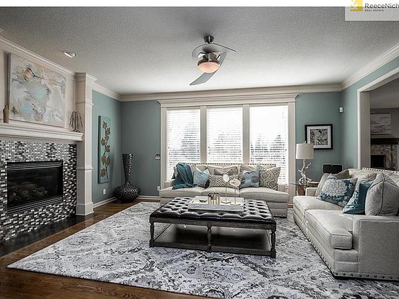 Bright, open great room with designer colors and lighting fixtures