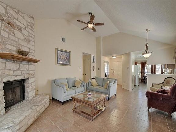 View of the front door and kitchen