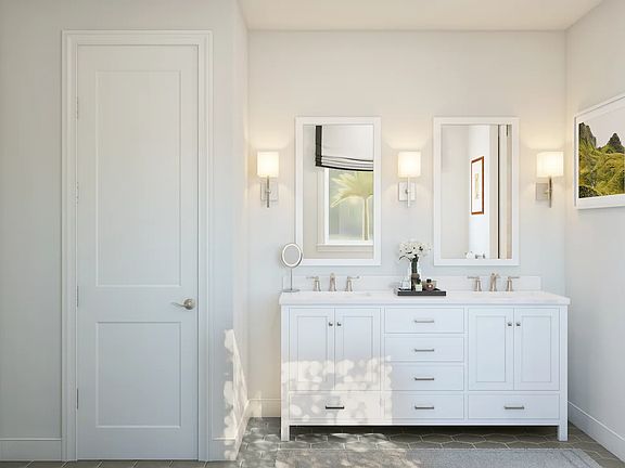 Primary bath featuring freestanding vanity with dual sinks