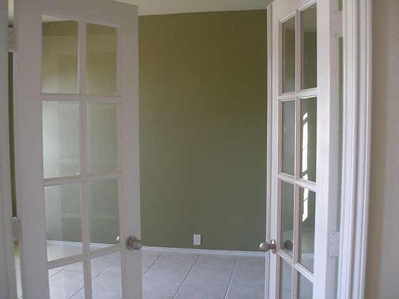  STUDY WITH FRENCH DOORS.