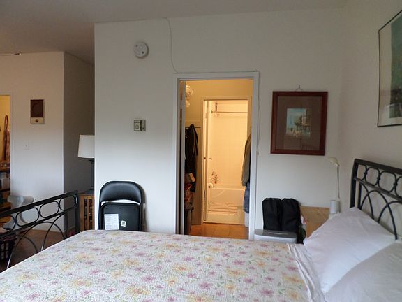 bed to walk-through closet to bathroom