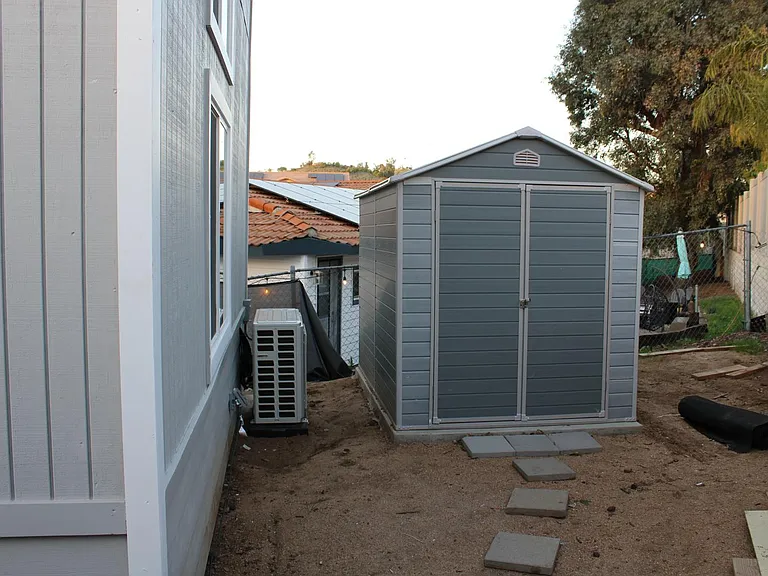 Private storage shed behind ADU