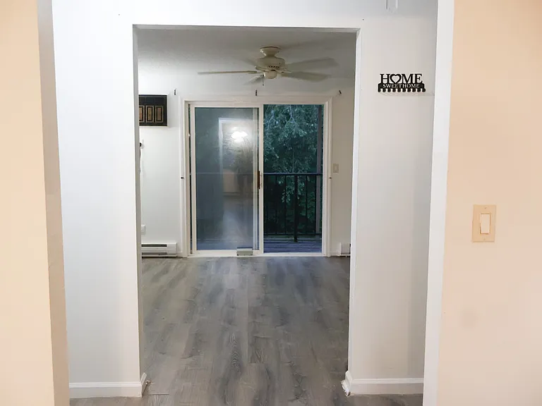 Living Room / Living Space _ Renovations Nearing Completion. New Baseboards Will Be Installed and the Fire Escape Door Will Be Freshly Painted.