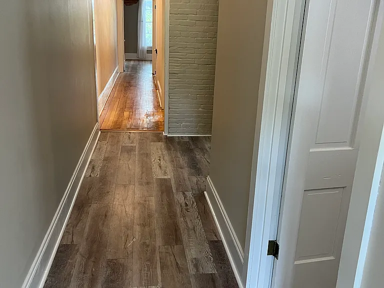 Entry hallway runs the length of the apartment.